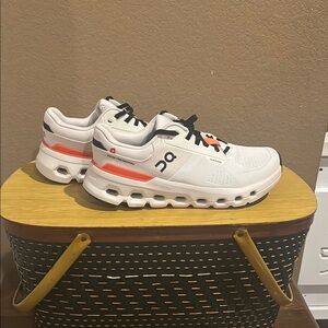On Running White and Orange Sneakers